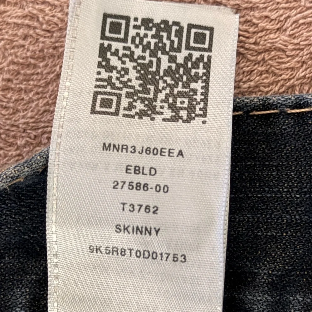 True Religion jeans feature a dark wash and bold signature stitching. Skinny